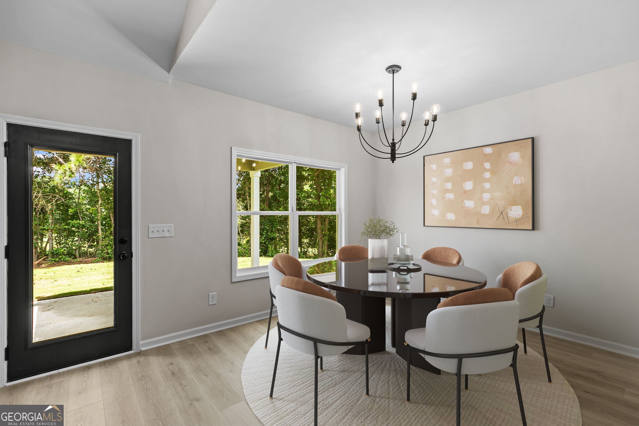 10 Avery Road Roopville, GA 30170 - Photo 17 of 46 a dining room with furniture a chandelier and wooden floor