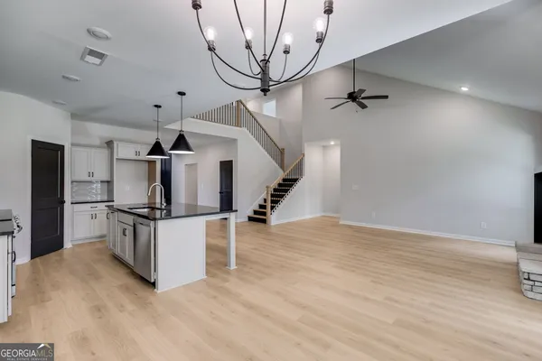 a view of kitchen with sink microwave and stove