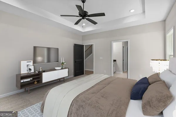a bedroom with bed and a chandelier