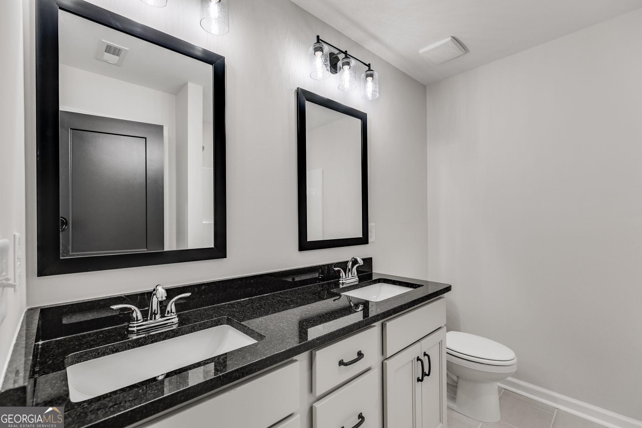 10 Avery Road Roopville, GA 30170 - Photo 35 of 46 a bathroom with a double vanity sink and a mirror