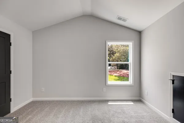 an empty room with windows