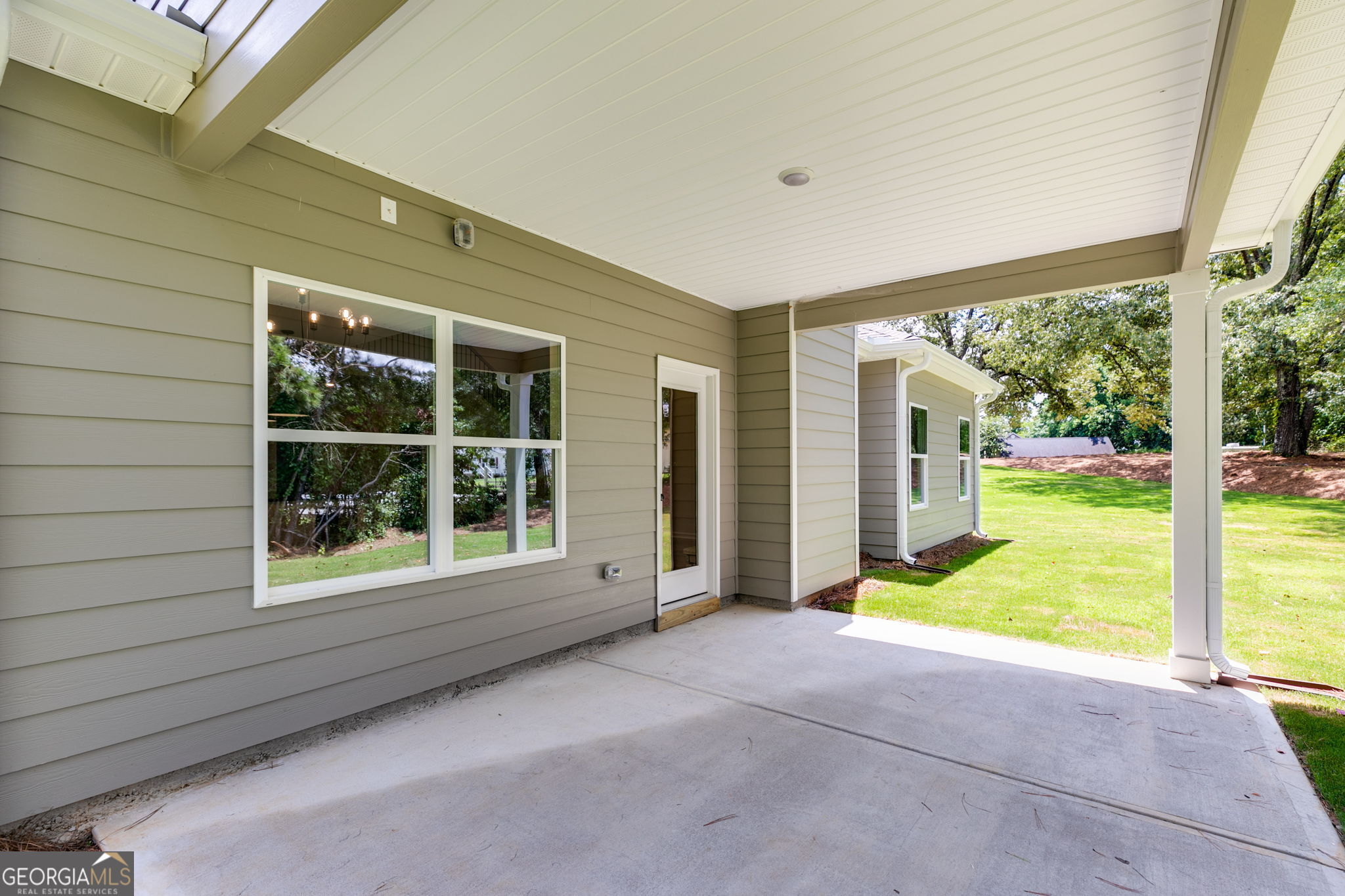 10 Avery Road Roopville, GA 30170 - Photo 41 of 46 a view of an empty room with a fireplace and a large window