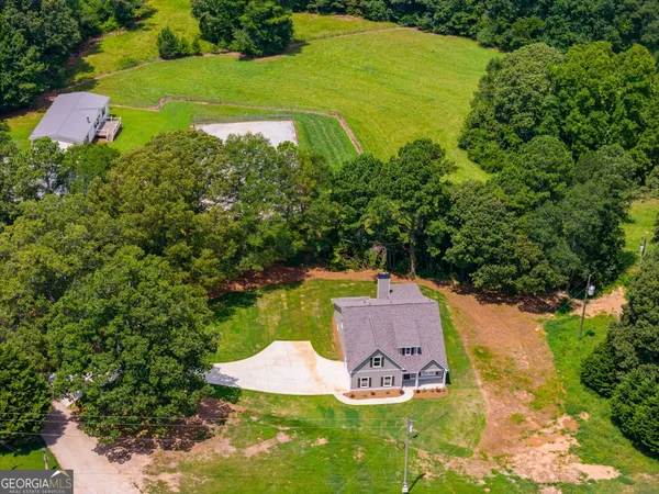 an aerial view of a house with a garden