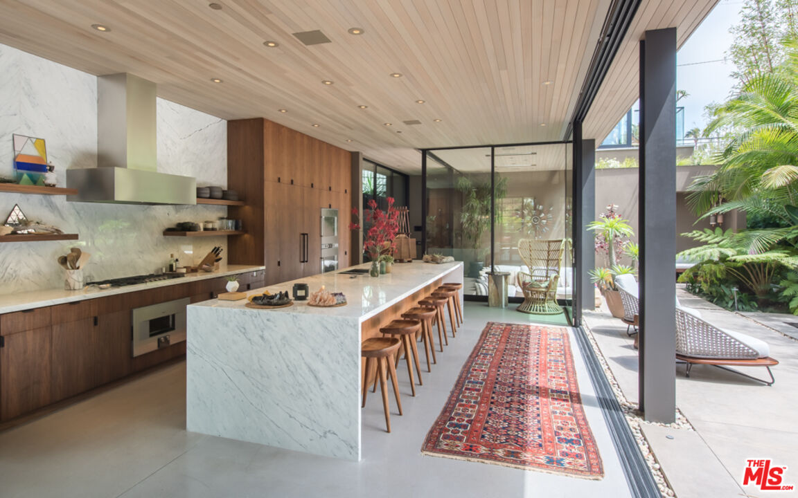 634 Milwood Avenue Venice, CA 90291 - Photo 12 of 40 a kitchen with sink a stove and cabinets
