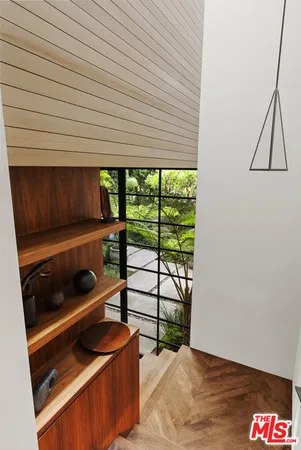a bed room with a bed and a window