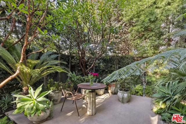 a view of a chairs and table in a patio
