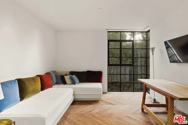 a bedroom with a large bed and a large window