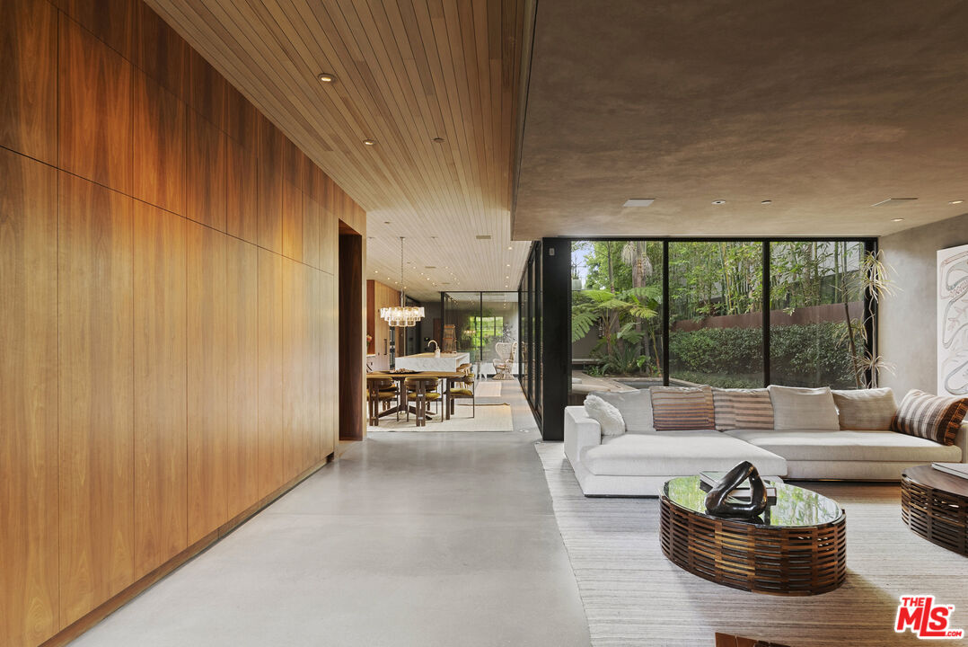 634 Milwood Avenue Venice, CA 90291 - Photo 5 of 40 a living room with furniture and a floor to ceiling window