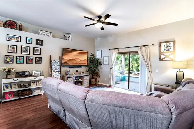 a bedroom with furniture and a wooden floor