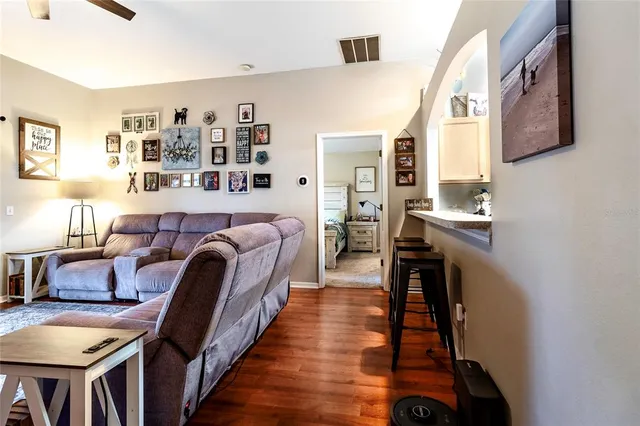 a workspace with wooden floor and a window