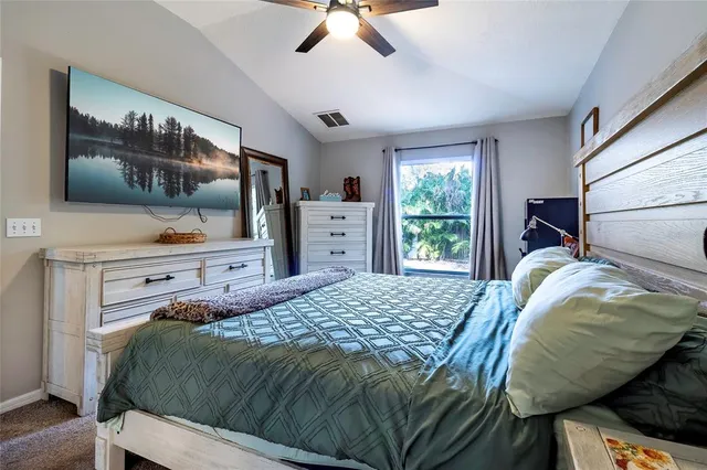 a spacious bathroom with a tub sink and mirror