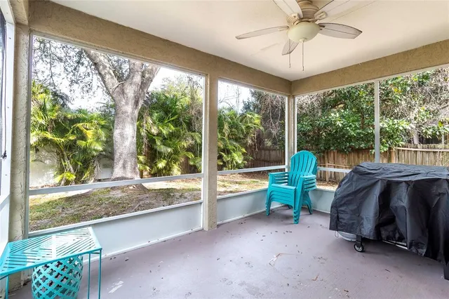 a view of a patio with a table chairs and a umbrella
