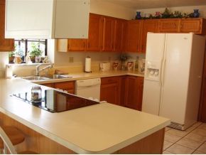937 Northeast Ripley Palm Bay, FL 32907 - Photo 2 of 12 a kitchen with stainless steel appliances a refrigerator and a sink