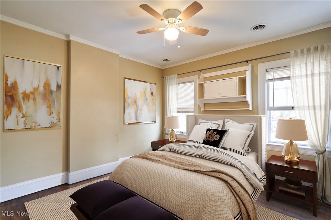 2152 Middlefield Road Cleveland, OH 44106 - Photo 13 of 50 Bedroom featuring ornamental molding, dark hardwood / wood-style floors, and ceiling fan