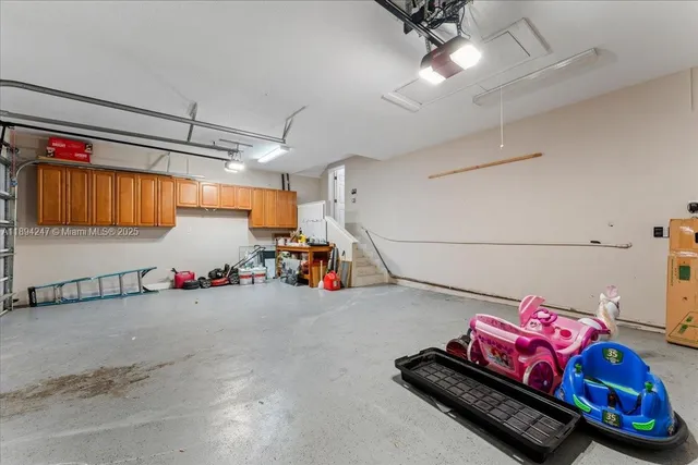an aerial view of ocean and residential houses with outdoor space and ocean view