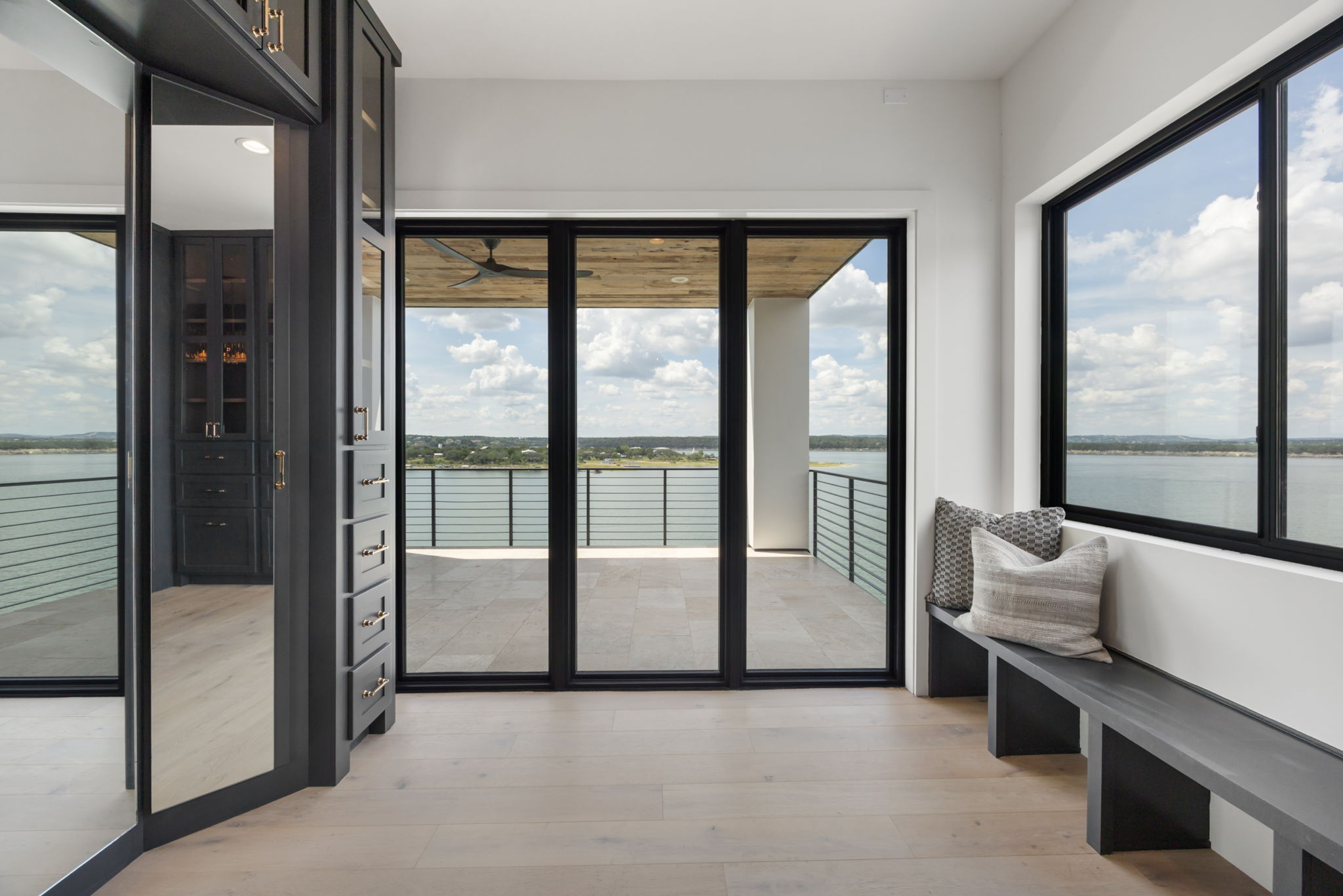 1496 Buffalo Gap Road Lakeway, TX 78734 - Photo 25 of 37 Unobstructed water views create a serene backdrop for daily living from this light-filled interior space.