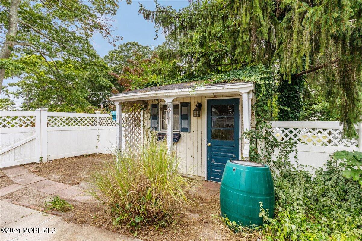 106 Forest Road Brick, NJ 08724 - Photo 20 of 23 a front view of a house with garden
