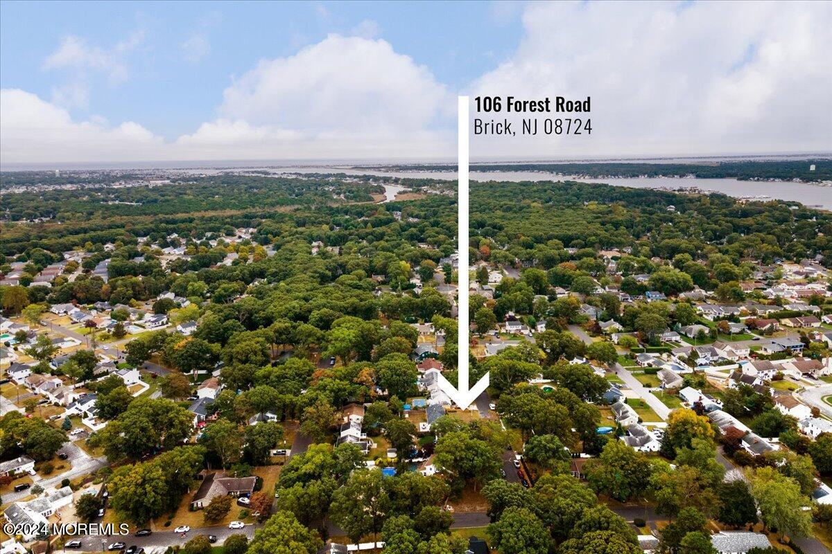 106 Forest Road Brick, NJ 08724 - Photo 22 of 23 a view of a sign that is sitting in a forest