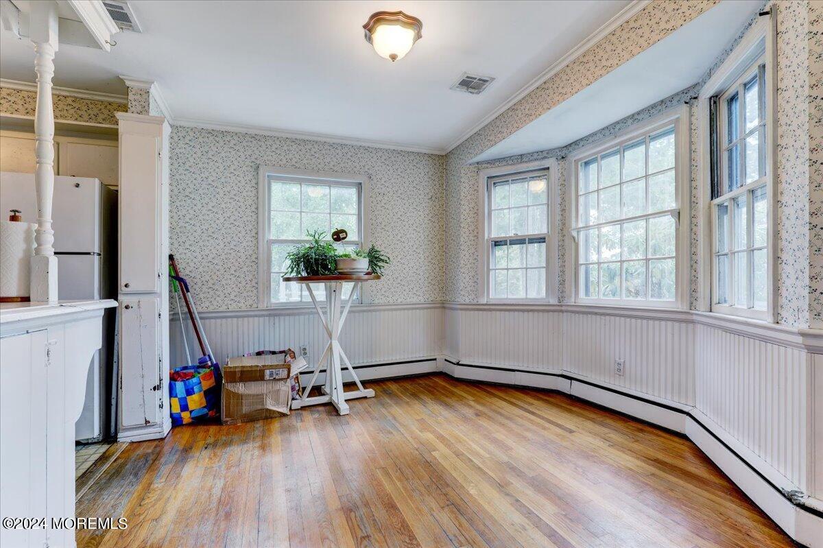 106 Forest Road Brick, NJ 08724 - Photo 4 of 23 a view of a room with gym equipment and a large window