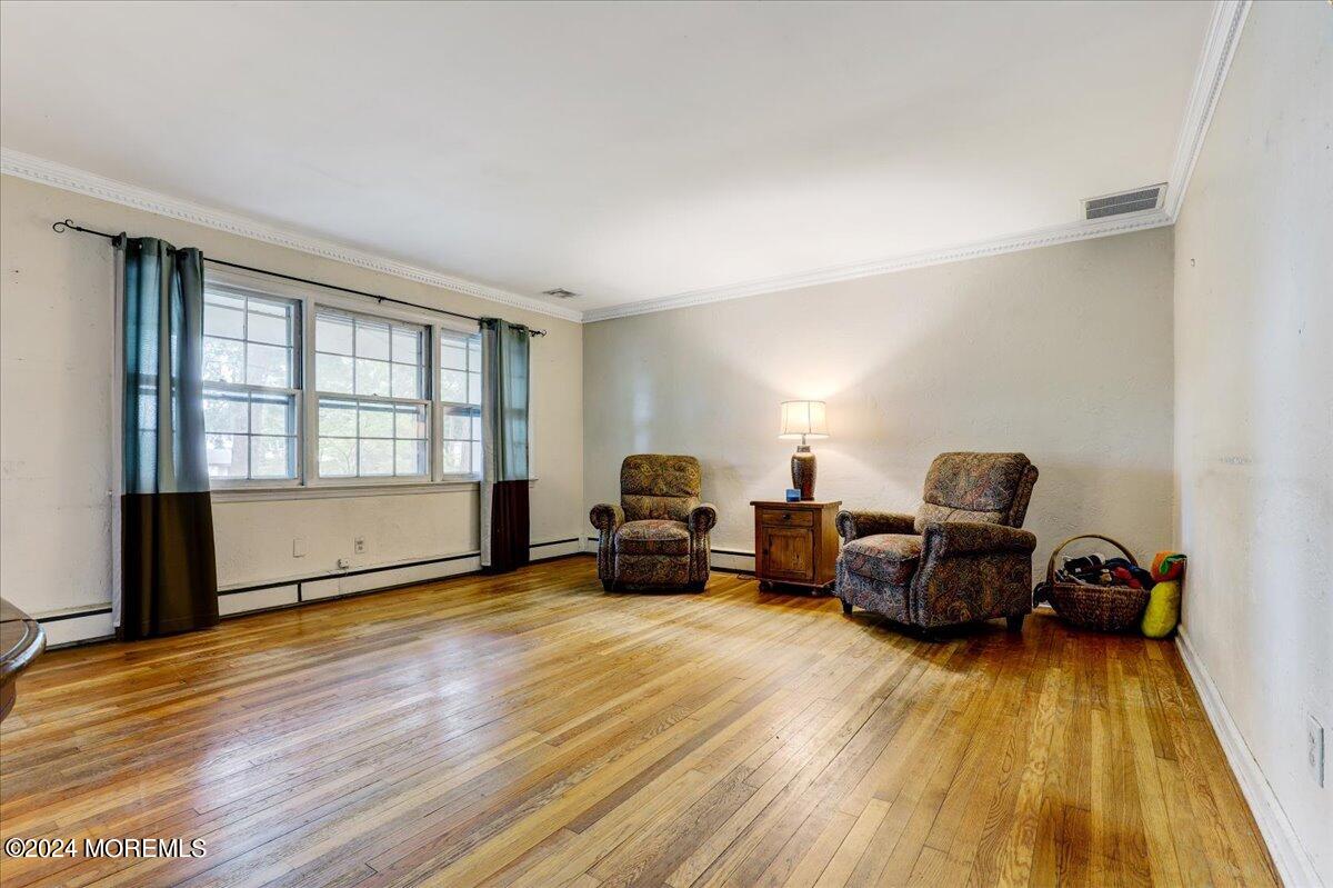 106 Forest Road Brick, NJ 08724 - Photo 9 of 23 a living room with furniture and a flat screen tv