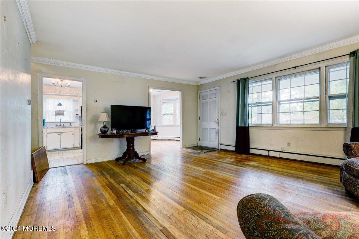 106 Forest Road Brick, NJ 08724 - Photo 10 of 23 a living room with furniture and a flat screen tv