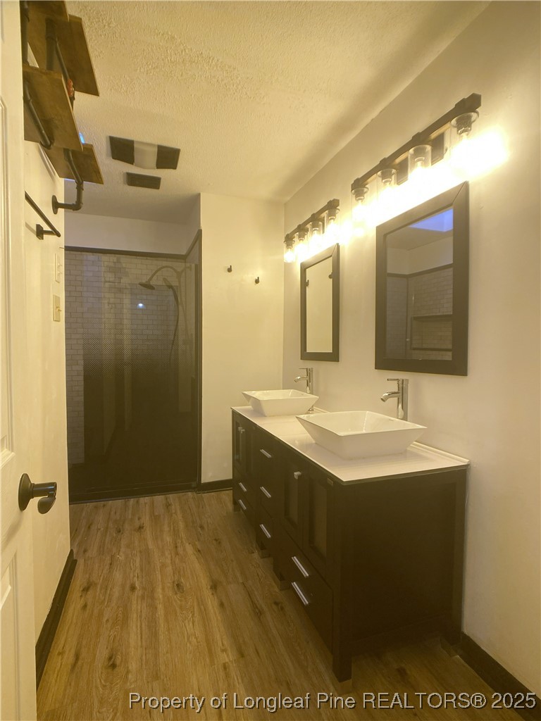 2405 Morganton Road Fayetteville, NC 28303 - Photo 21 of 46 a bathroom with a sink and a mirror