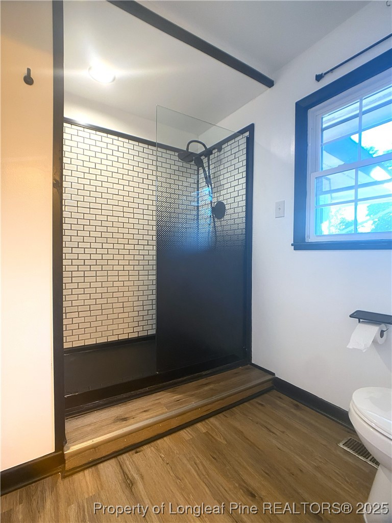 2405 Morganton Road Fayetteville, NC 28303 - Photo 30 of 46 a view of bathroom with a toilet and a shower