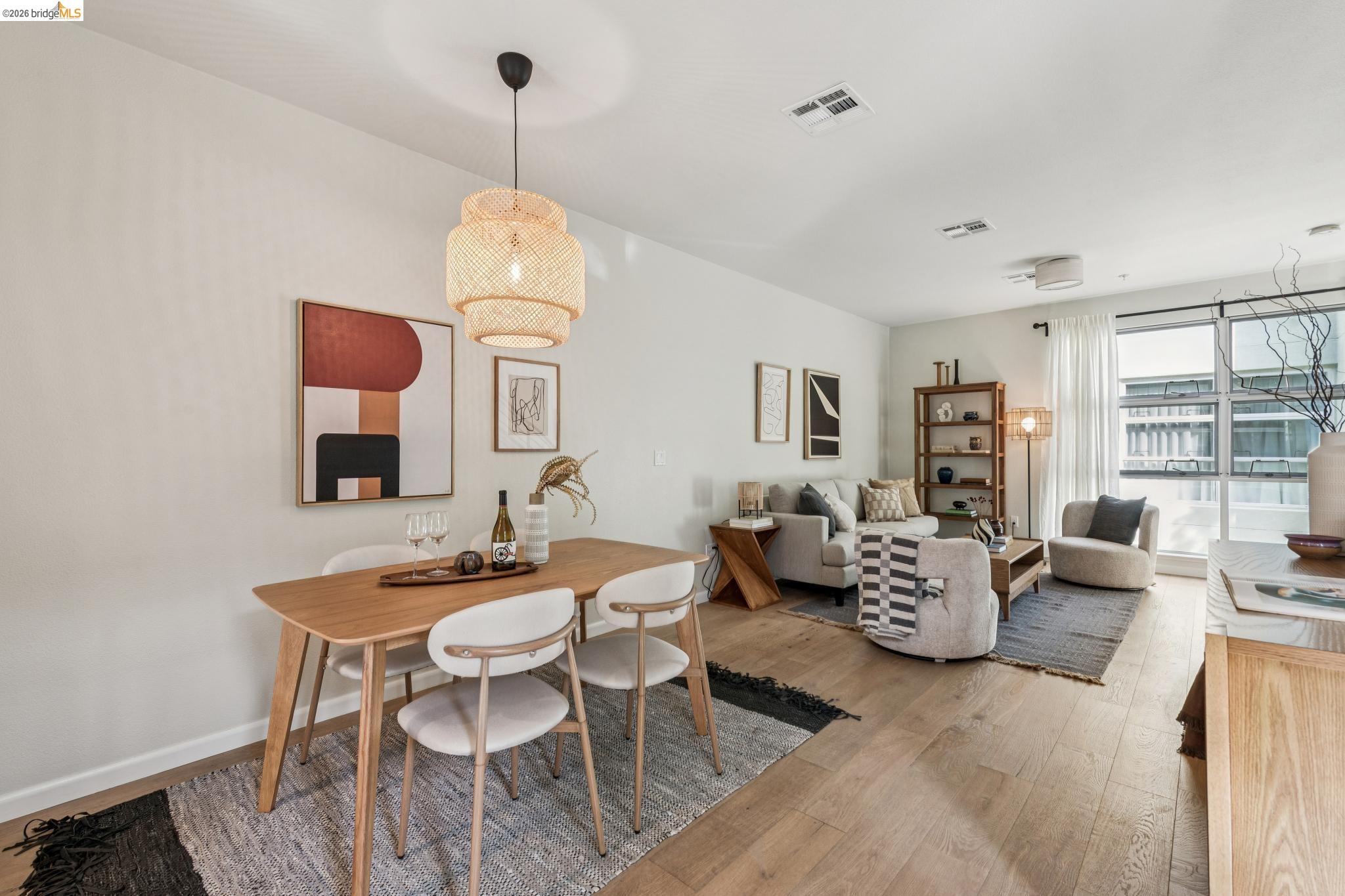 61 Glashaus Loop Emeryville, CA 94608 - Photo 14 of 39 a dining room with furniture window and wooden floor