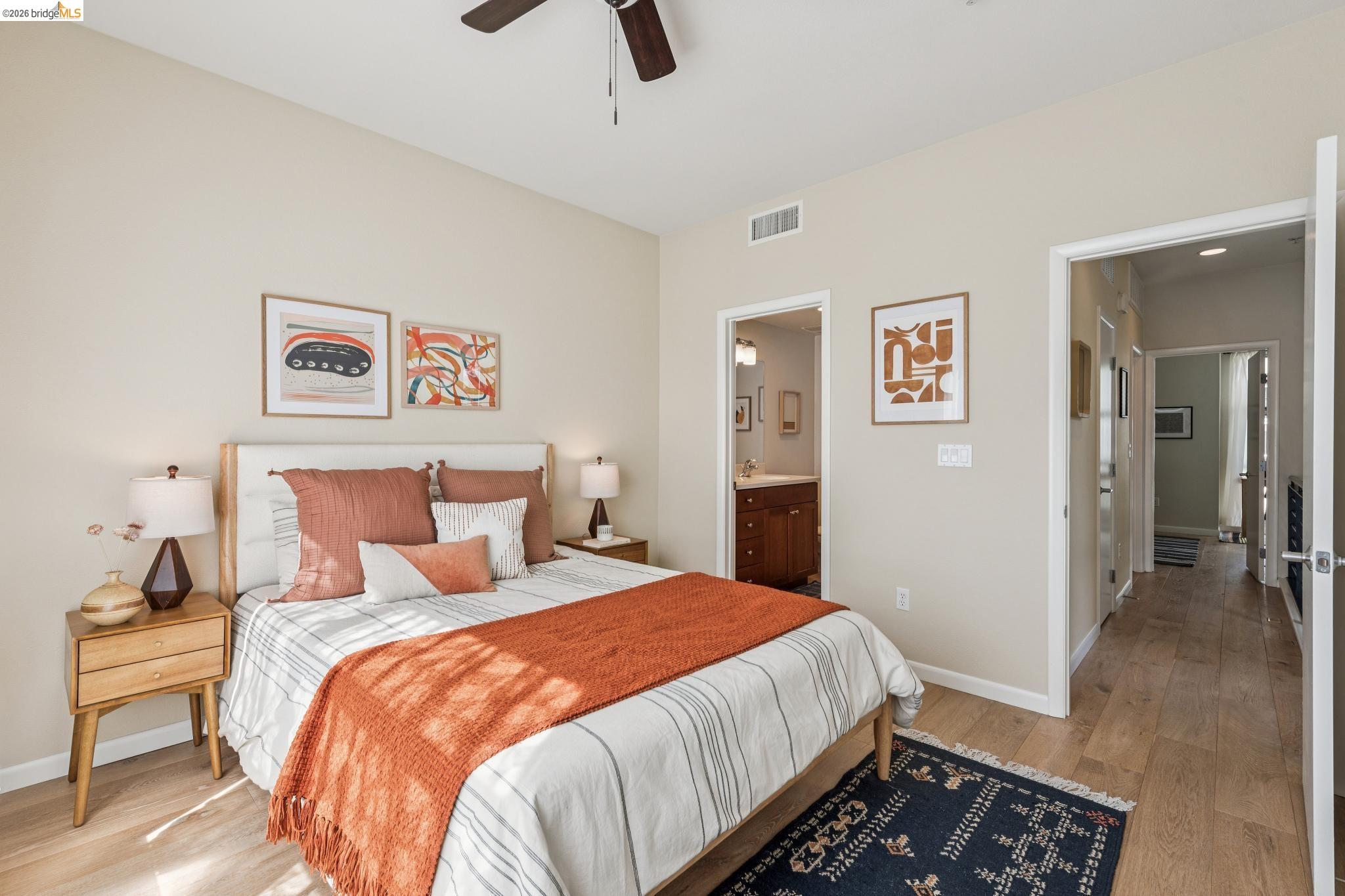 61 Glashaus Loop Emeryville, CA 94608 - Photo 24 of 39 a bedroom with bed and wooden floor