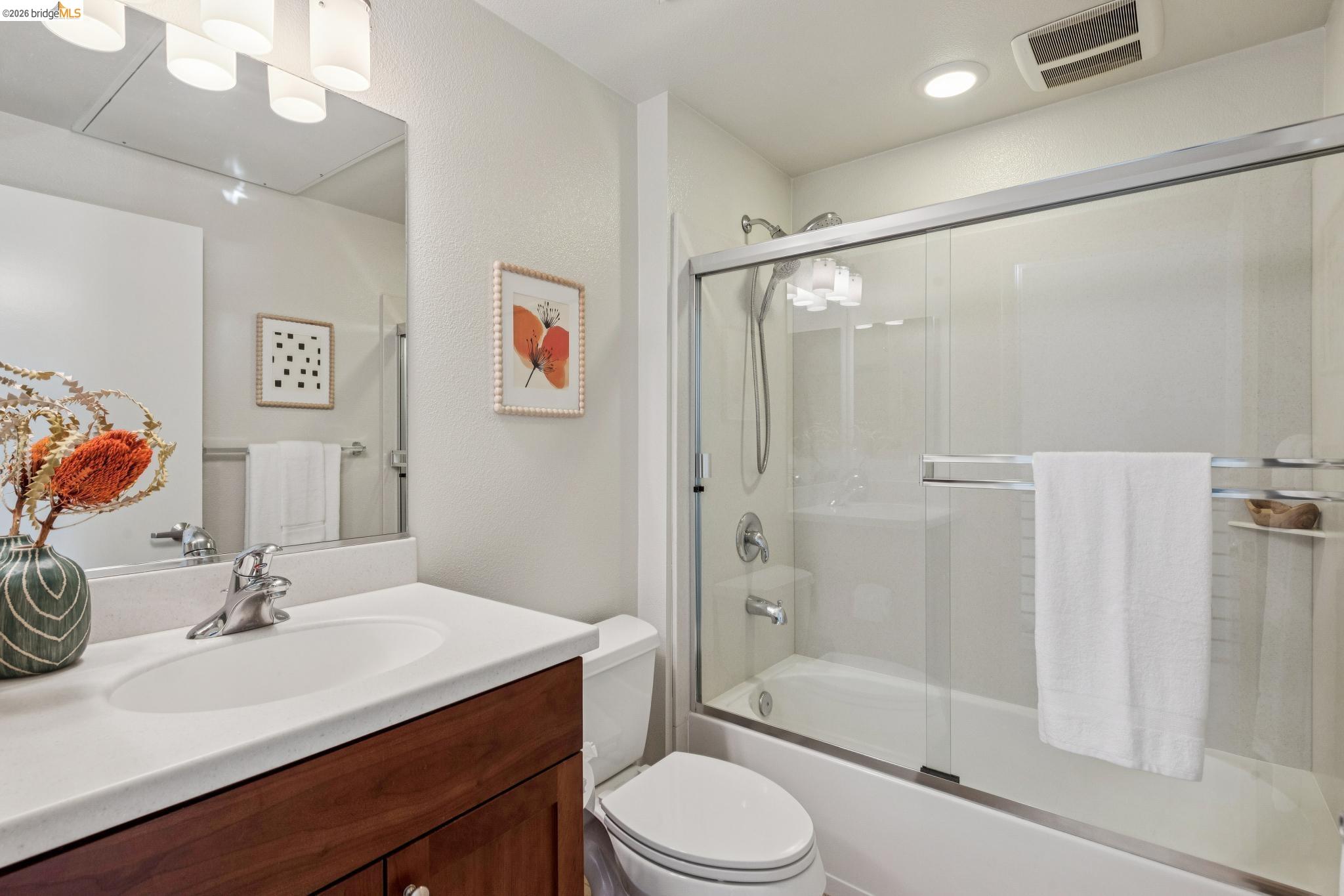 61 Glashaus Loop Emeryville, CA 94608 - Photo 32 of 39 a bathroom with a sink vanity mirror and toilet