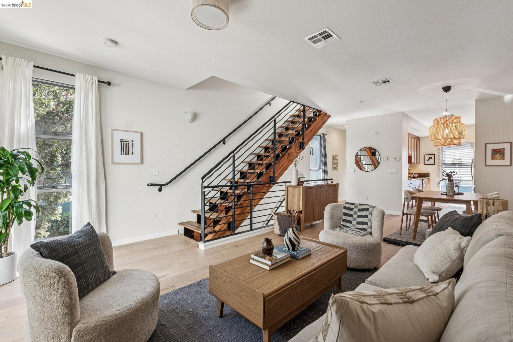 61 Glashaus Loop Emeryville, CA 94608 - Photo 9 of 39 a living room with furniture and wooden floor