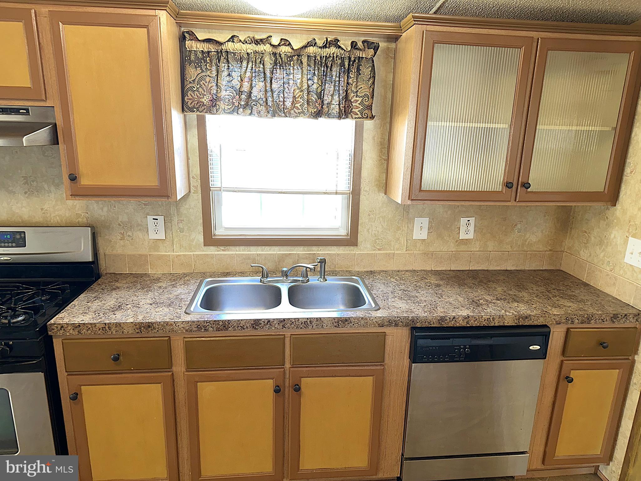 4322 Ridge Drive Mount Airy, MD 21771 - Photo 5 of 31 a kitchen with granite countertop a sink a counter space and a window