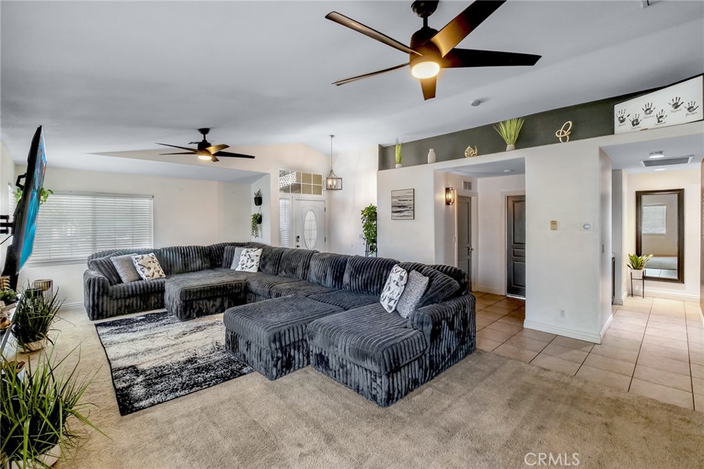 14952 Rivers Edge Road Helendale, CA 92342 - Photo 10 of 33 a living room with furniture and a ceiling fan