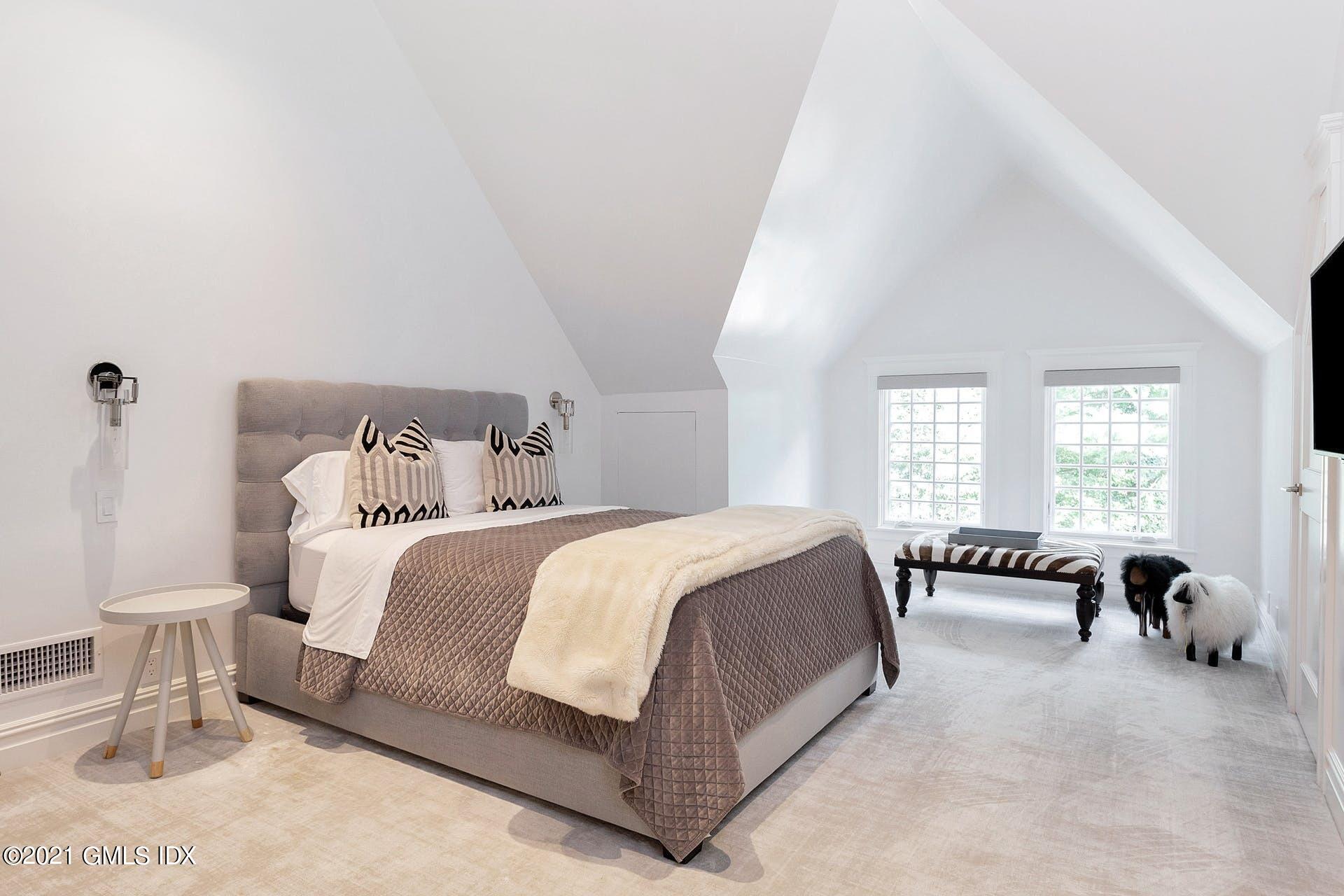 54 Pecksland Road Greenwich, CT 06831 - Photo 31 of 40 a bedroom with a bed and a couch