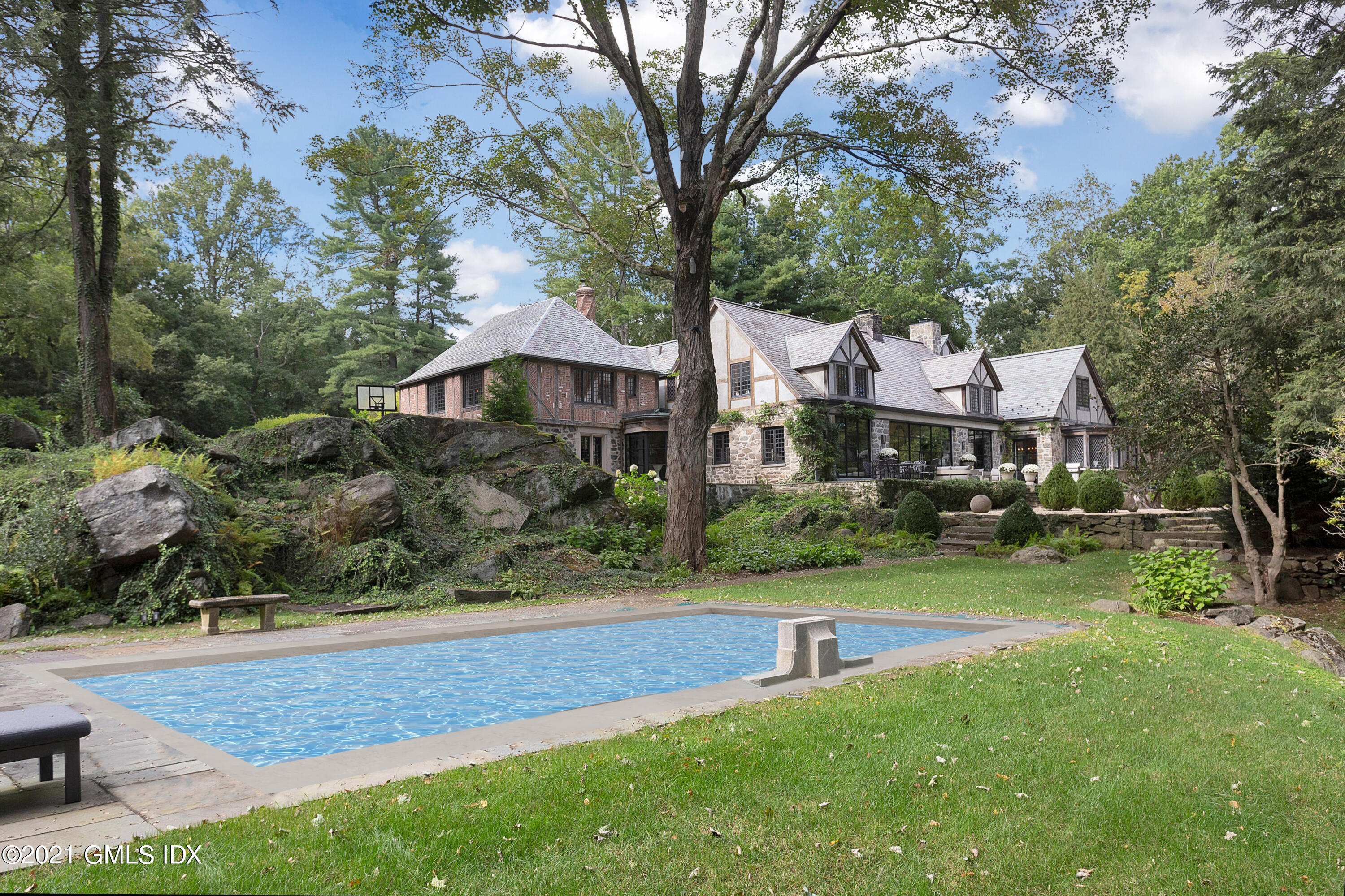 54 Pecksland Road Greenwich, CT 06831 - Photo 34 of 40 a front view of a house with garden