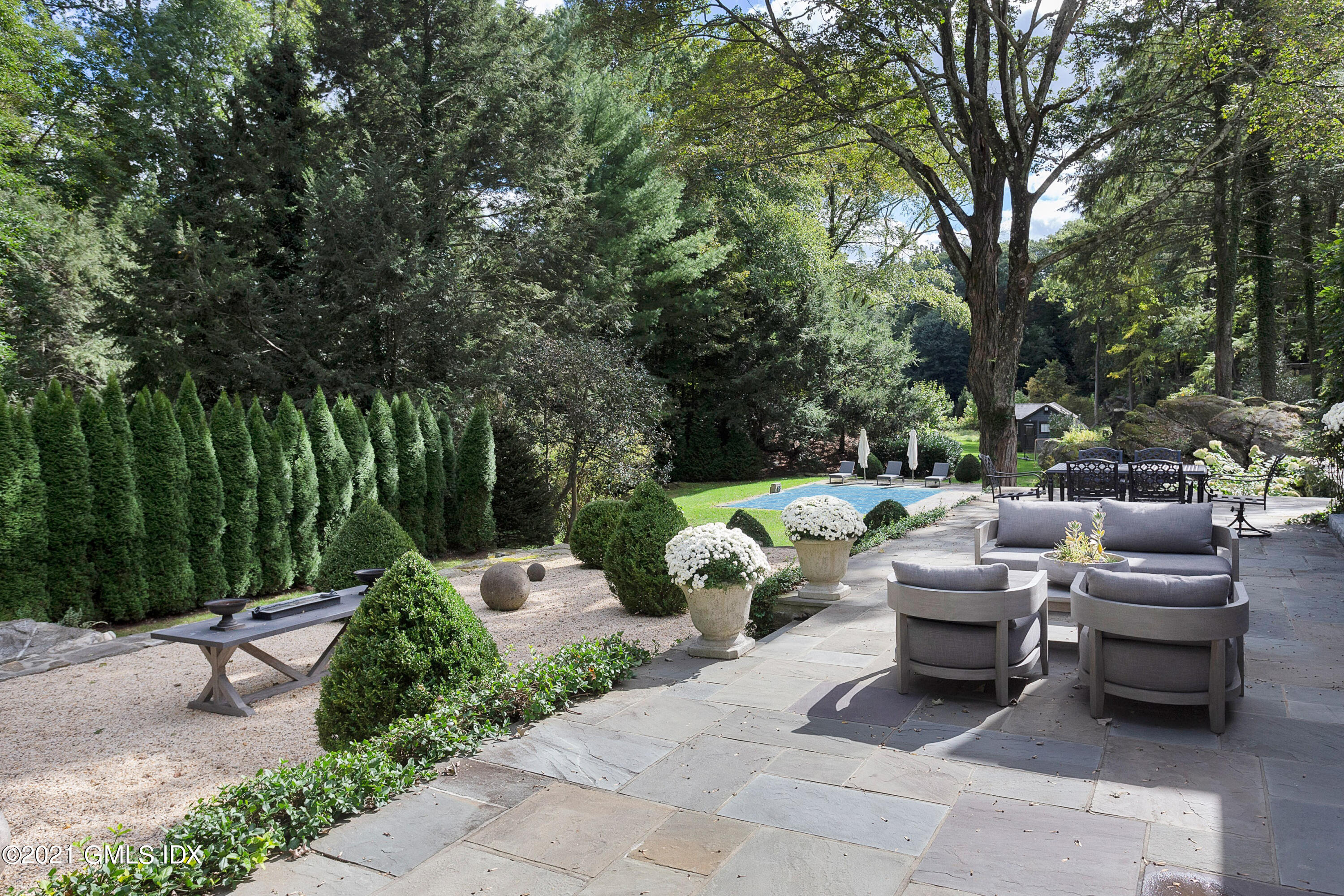 54 Pecksland Road Greenwich, CT 06831 - Photo 6 of 40 a view of a patio with couches and a fire pit