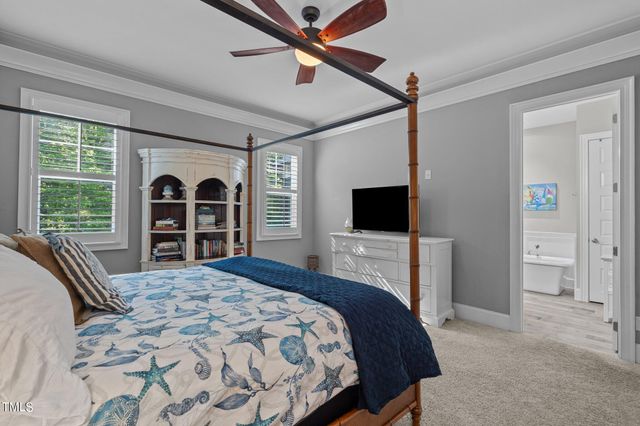 a spacious bathroom with a granite countertop tub sink a mirror a shower and vanity
