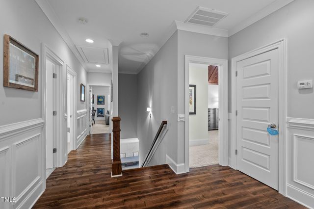 a living room with furniture a flat screen tv and a large window