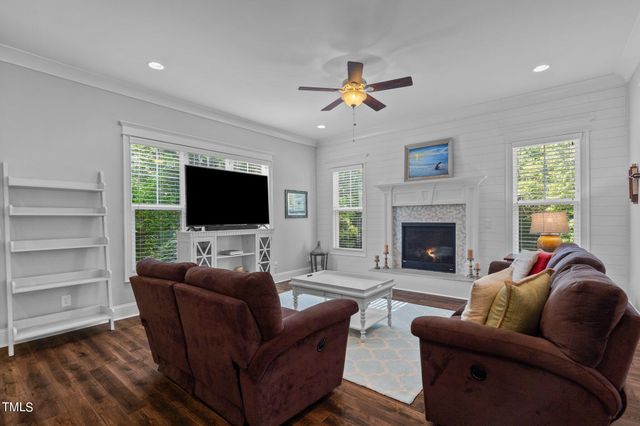 a open kitchen with stainless steel appliances granite countertop a stove and a wooden floors