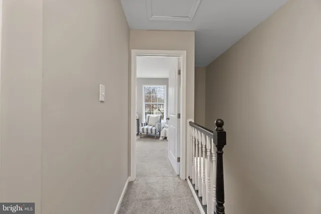 a view of bathroom with a sink and a mirror