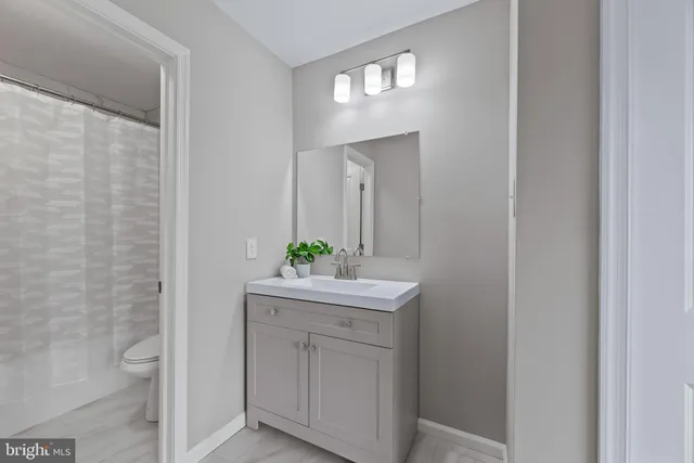 a bathroom with a bathtub a toilet and a shower