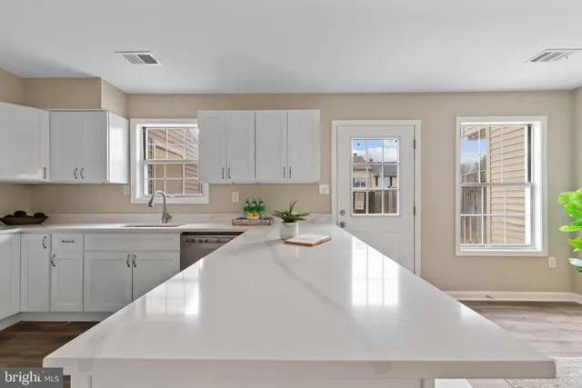 a view of a dining room with furniture and window