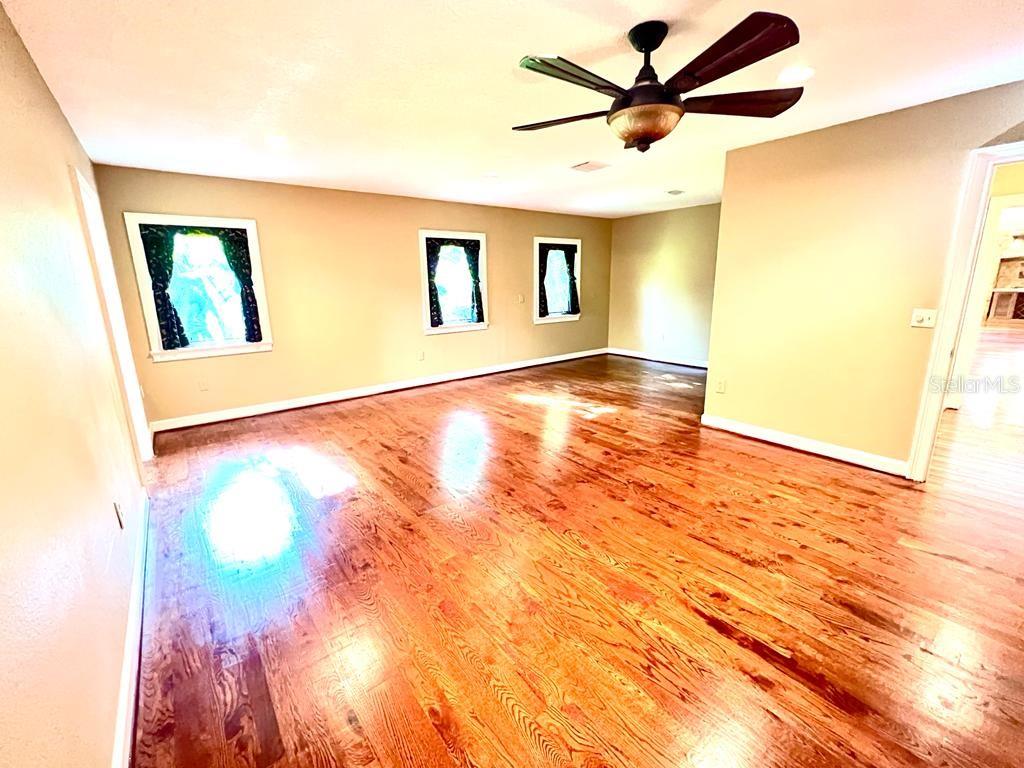 5610 West Lake Butler Road Windermere, FL 34786 - Photo 7 of 32 a view of a big room with wooden floor