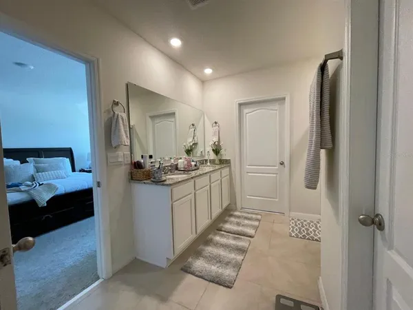 a bathroom with a sink and mirror
