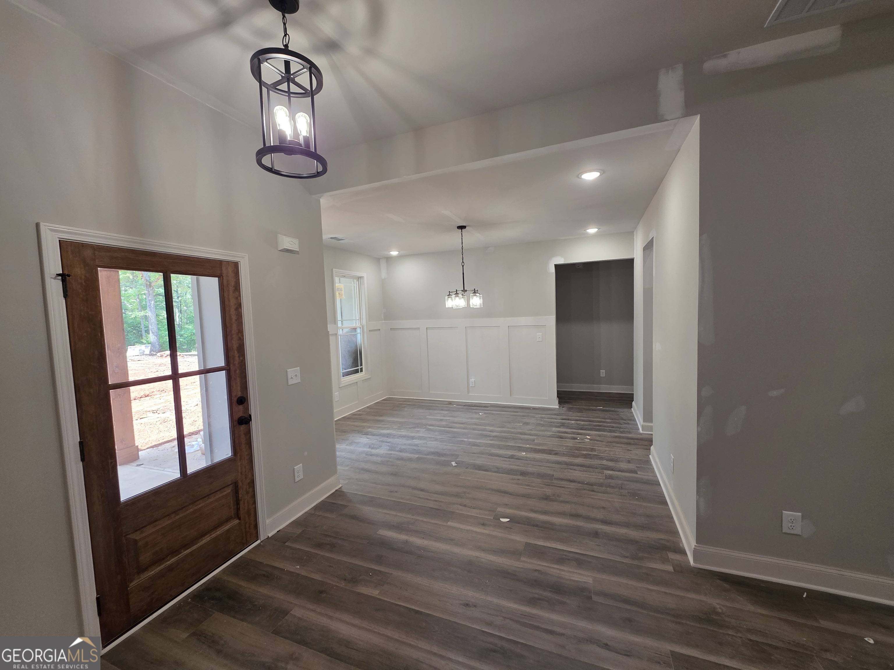 215 Panola Road Jackson, GA 30233 - Photo 4 of 16 a view of empty room with wooden floor and window