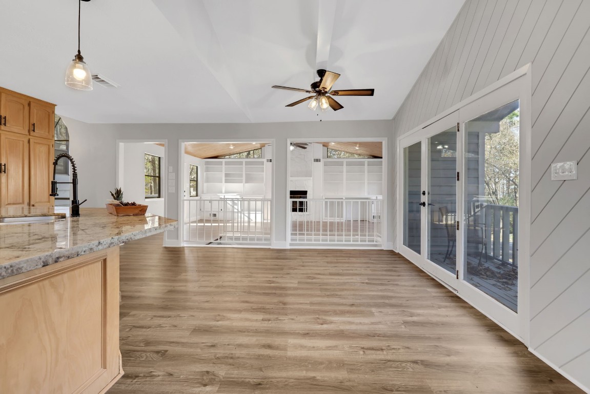 330 North Fairway Loop Coldspring, TX 77331 - Photo 11 of 40 a view of an empty room with window and wooden floor