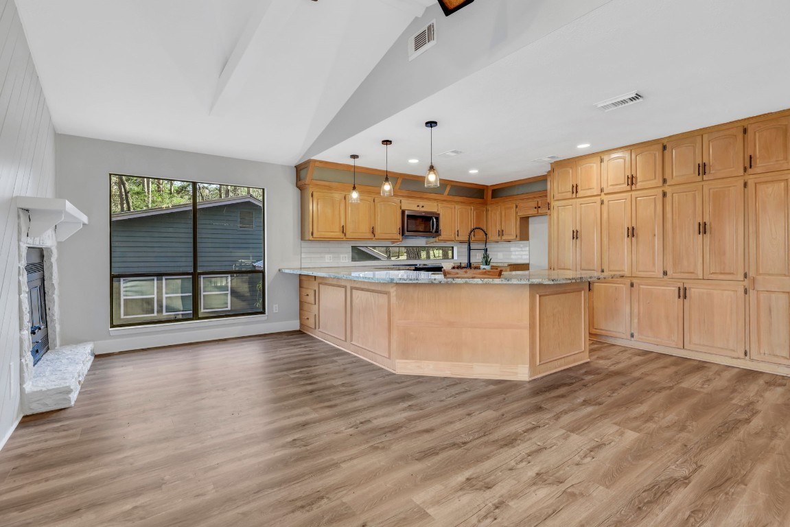 330 North Fairway Loop Coldspring, TX 77331 - Photo 12 of 40 a view of kitchen with stainless steel appliances granite countertop cabinets and wooden floor