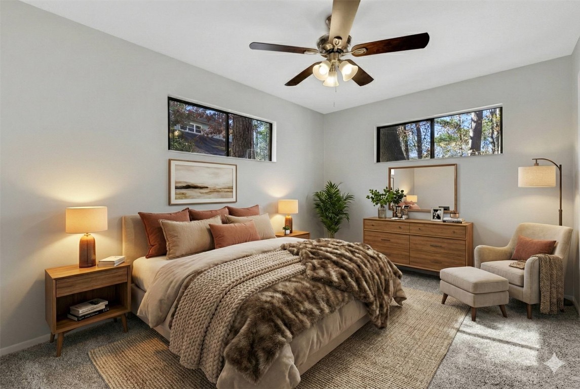 330 North Fairway Loop Coldspring, TX 77331 - Photo 24 of 40 a bedroom with a bed a couch and a chandelier