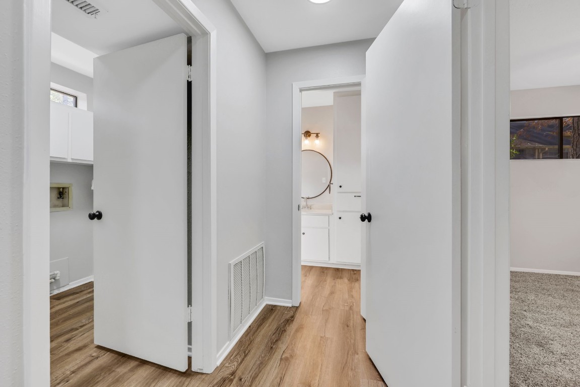 330 North Fairway Loop Coldspring, TX 77331 - Photo 26 of 40 a view of a bathroom with wooden floor and mirror