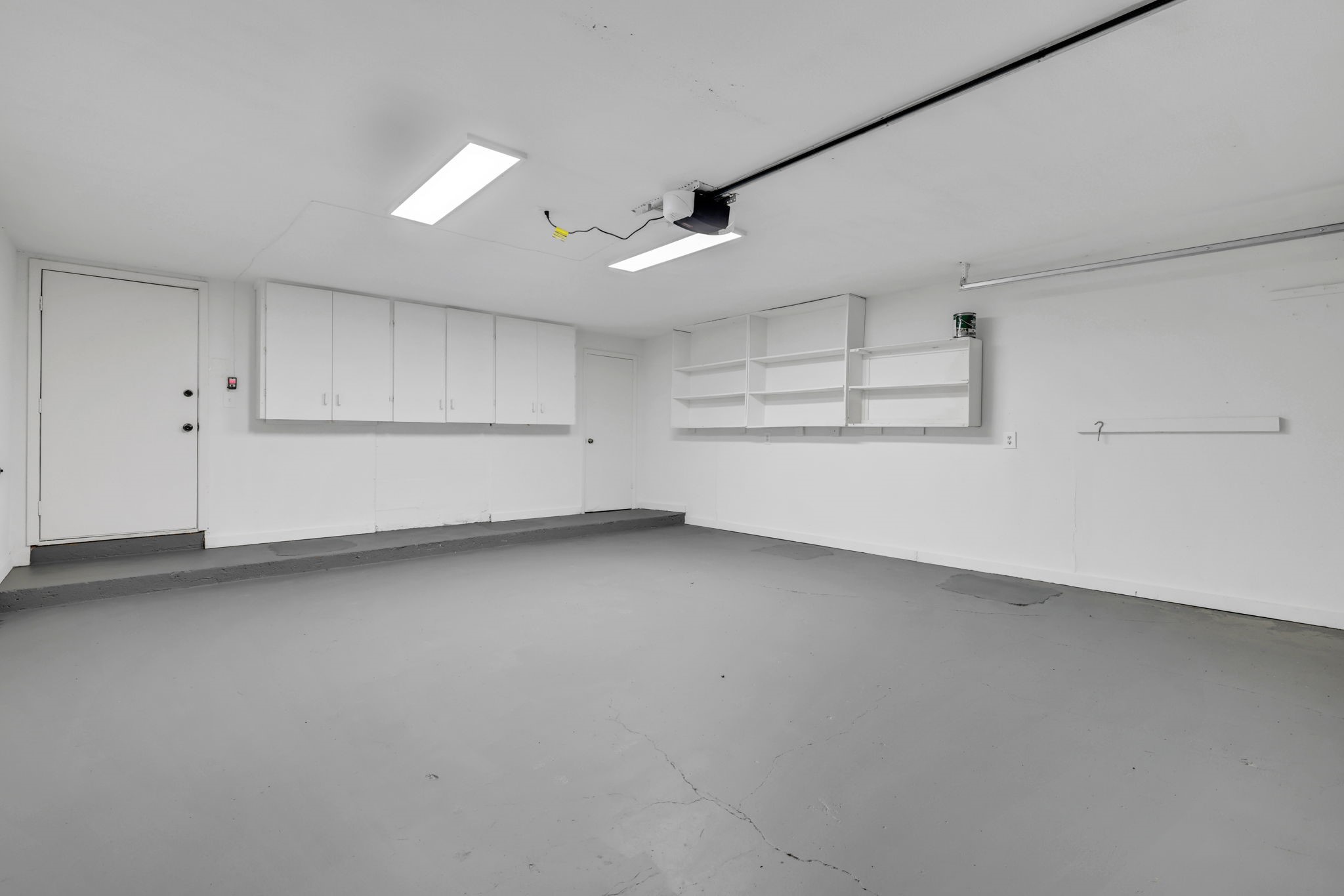 330 North Fairway Loop Coldspring, TX 77331 - Photo 27 of 40 Cabinets and built in shelves in the two car garage.